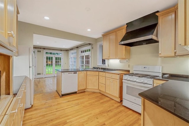 1167 Murray Hill Ave, Squirrel Hill, PA 15217 - kitchen featuring white appliances, wall chimney exhaust hood, light brown cabinetry, a peninsula, and light wood-type flooring