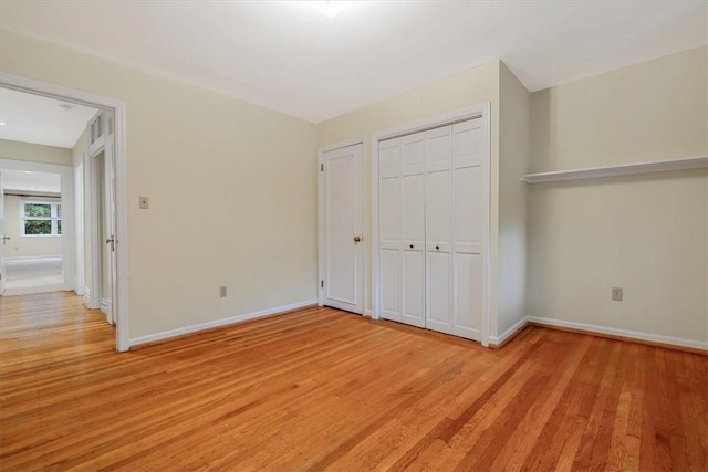 1167 Murray Hill Ave, Squirrel Hill, PA 15217 - unfurnished bedroom with light wood finished floors, baseboards, and a closet