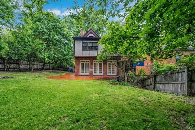 1167 Murray Hill Ave, Squirrel Hill, PA 15217 - rear view of property featuring french doors, a chimney, and brick siding