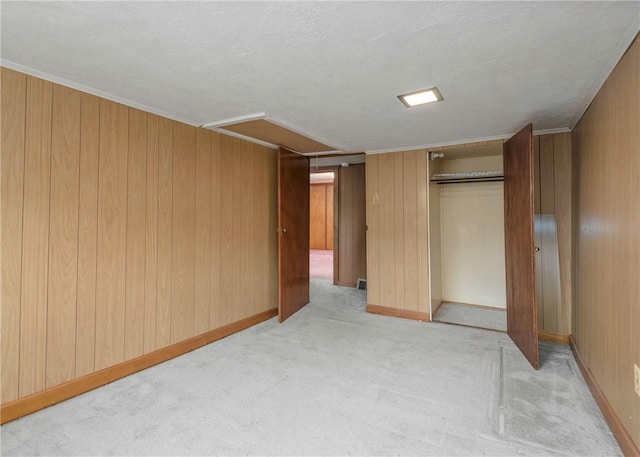 2555 Cole Rd, Marshall, PA 15090 - unfurnished bedroom with a closet, light carpet, wooden walls, and baseboards