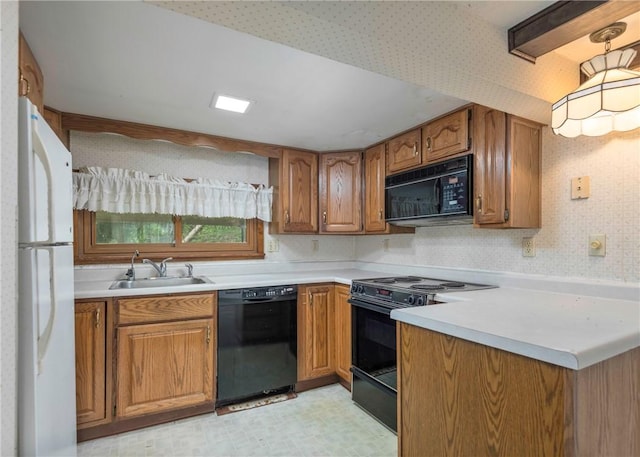 2555 Cole Rd, Marshall, PA 15090 - kitchen featuring black appliances, a sink, brown cabinetry, light countertops, and light flooring