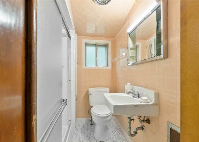 2555 Cole Rd, Marshall, PA 15090 - bathroom featuring toilet, tile patterned flooring, tile walls, and a sink