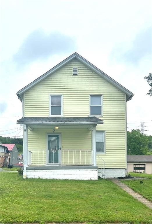 7 Fairview Pl, Union Twp Wsh, PA 15038 - rear view of house with a porch and a lawn