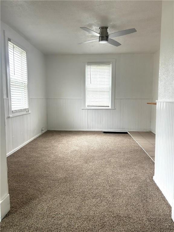 7 Fairview Pl, Union Twp Wsh, PA 15038 - empty room with wainscoting, carpet flooring, and a ceiling fan