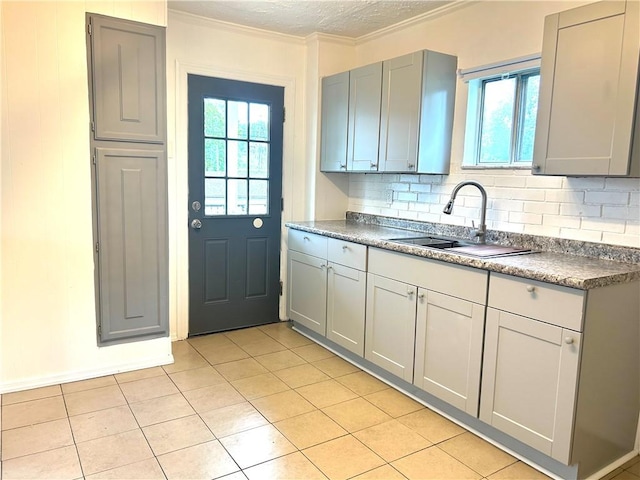 7 Fairview Pl, Union Twp Wsh, PA 15038 - kitchen featuring a sink, gray cabinetry, crown molding, backsplash, and light tile patterned floors