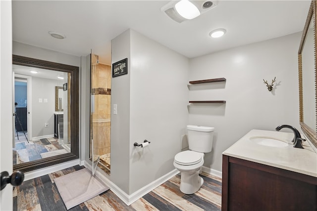 1182 W Laurel Cir, Mount Pleasant Twp, PA 15666 - full bath with toilet, wood finished floors, vanity, a stall shower, and baseboards