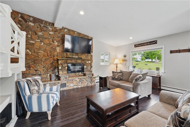 1182 W Laurel Cir, Mount Pleasant Twp, PA 15666 - living area featuring a stone fireplace, baseboard heating, and wood finished floors