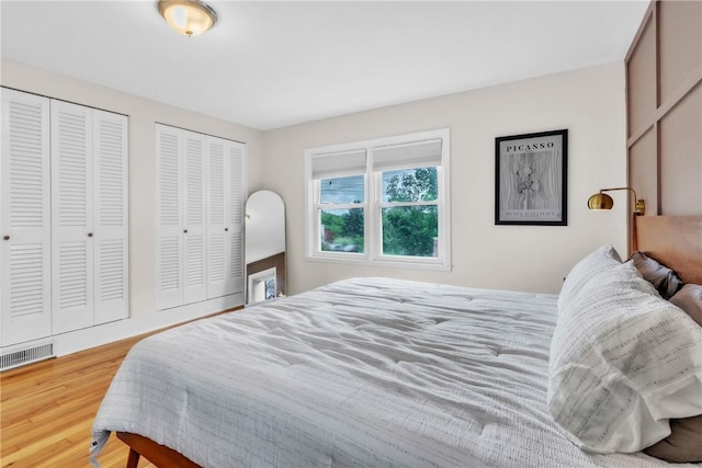 132 Crescent Hills Rd, Penn Hills, PA 15235 - bedroom featuring two closets and wood finished floors