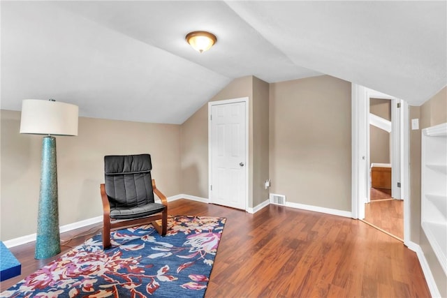 132 Crescent Hills Rd, Penn Hills, PA 15235 - living area featuring wood finished floors, lofted ceiling, and baseboards