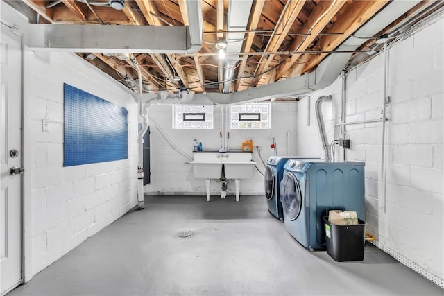 132 Crescent Hills Rd, Penn Hills, PA 15235 - basement featuring separate washer and dryer, concrete block wall, and a sink