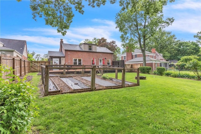 132 Crescent Hills Rd, Penn Hills, PA 15235 - back of house with a garden, a chimney, and brick siding