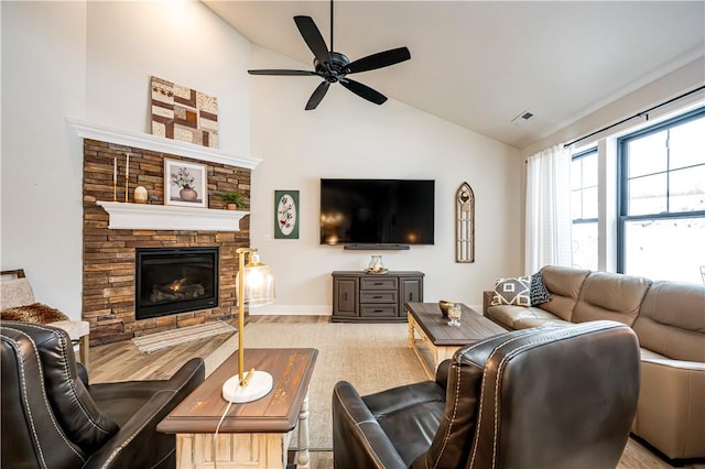 1006 Sweetgum Ct, Penn Twp Wml, PA 15644 - living room with ceiling fan, a stone fireplace, high vaulted ceiling, and wood finished floors