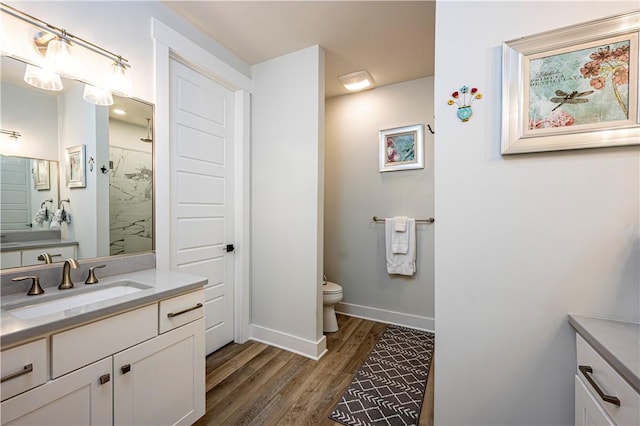 1006 Sweetgum Ct, Penn Twp Wml, PA 15644 - full bathroom featuring vanity, wood finished floors, baseboards, toilet, and a shower