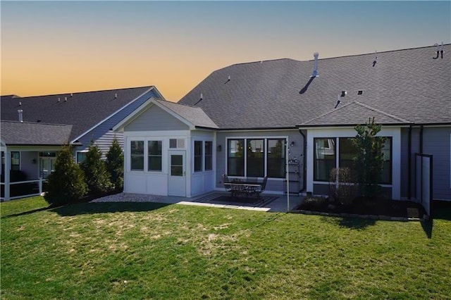 1006 Sweetgum Ct, Penn Twp Wml, PA 15644 - back of house featuring a lawn, a patio area, and roof with shingles