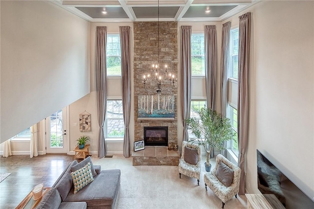 1703 Stevensan, Franklin Park, PA 15143 - living area featuring a fireplace, healthy amount of natural light, coffered ceiling, beam ceiling, and a chandelier