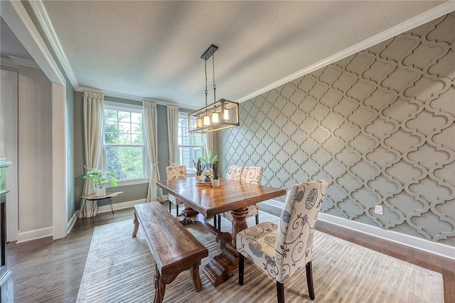 1703 Stevensan, Franklin Park, PA 15143 - dining space with wallpapered walls, ornamental molding, baseboards, a chandelier, and wood finished floors