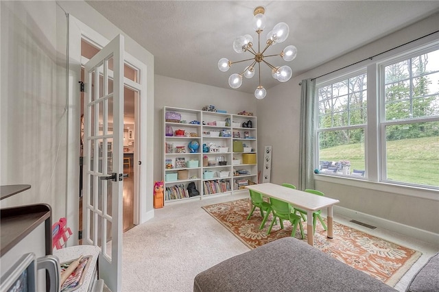 1703 Stevensan, Franklin Park, PA 15143 - recreation room with carpet flooring, a chandelier, and baseboards