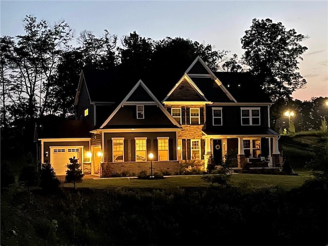 1703 Stevensan, Franklin Park, PA 15143 - view of front of house with covered porch, stone siding, a garage, and a front lawn
