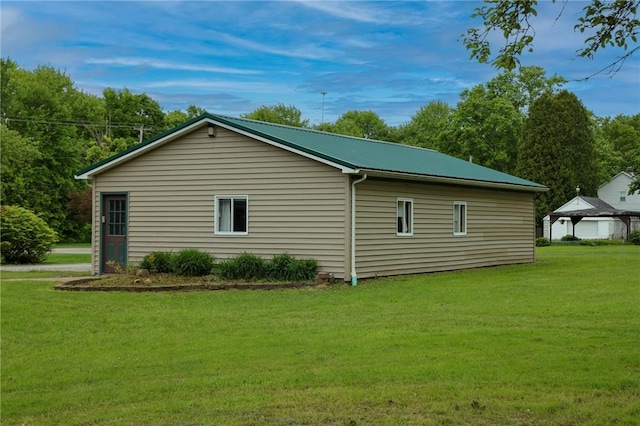 1778 Mercer Rd, Lake Twp, PA 16133 - view of side of property featuring a lawn and metal roof