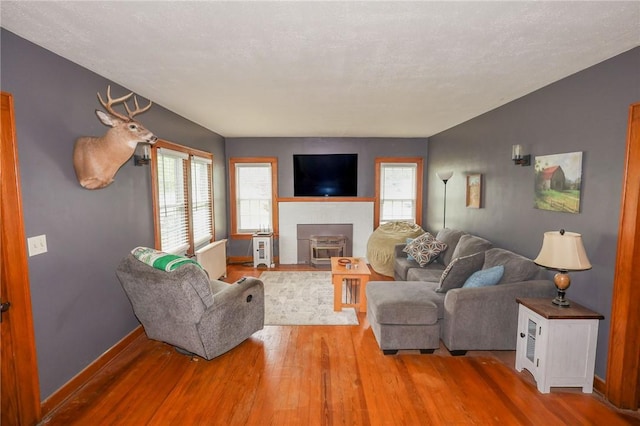 1778 Mercer Rd, Lake Twp, PA 16133 - living area with wood finished floors, plenty of natural light, and baseboards
