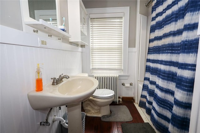 1778 Mercer Rd, Lake Twp, PA 16133 - full bath with radiator heating unit, wood finished floors, toilet, and shower / bath combination with curtain