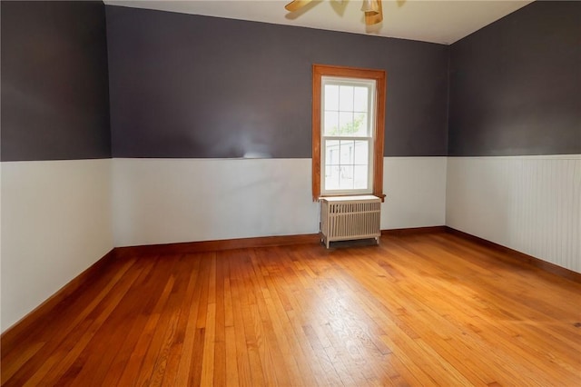 1778 Mercer Rd, Lake Twp, PA 16133 - spare room with radiator, hardwood / wood-style flooring, and a ceiling fan