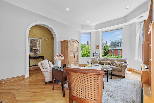 6015 Walnut St Unit 201, Shadyside, PA 15206 - living area featuring arched walkways, baseboards, and recessed lighting