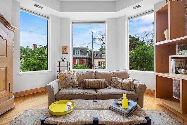 6015 Walnut St Unit 201, Shadyside, PA 15206 - living area featuring light wood-type flooring, plenty of natural light, and baseboards
