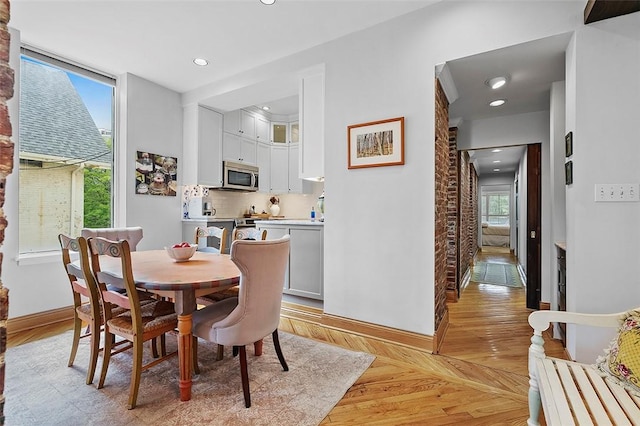 6015 Walnut St Unit 201, Shadyside, PA 15206 - dining room featuring baseboards, light wood-style floors, and recessed lighting