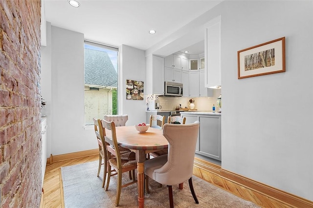 6015 Walnut St Unit 201, Shadyside, PA 15206 - dining room with light wood-style flooring, recessed lighting, and baseboards