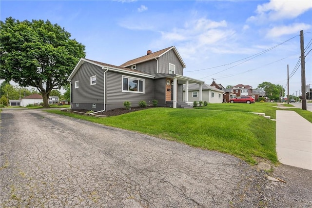 1218 W Ridge Ave, Sharpsville, PA 16150 - view of front facade with a front yard and a chimney