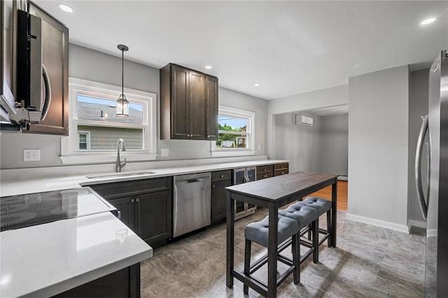 1218 W Ridge Ave, Sharpsville, PA 16150 - kitchen featuring appliances with stainless steel finishes, a sink, hanging light fixtures, light countertops, and recessed lighting