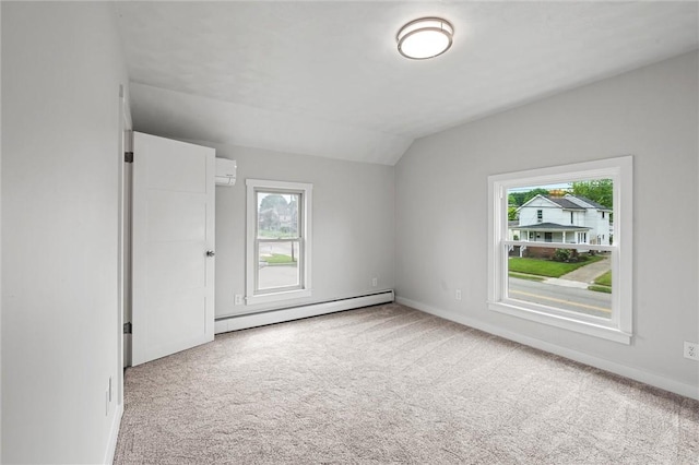 1218 W Ridge Ave, Sharpsville, PA 16150 - carpeted empty room featuring baseboard heating, vaulted ceiling, plenty of natural light, an AC wall unit, and baseboards