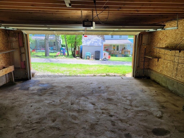 310 Whitesell St, Bell Twp, PA 15680 - garage featuring a garage door opener