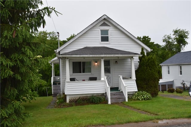 117 Oregon, Vandergrift Wml, PA 15690 - bungalow featuring a porch, a front yard, and a shingled roof