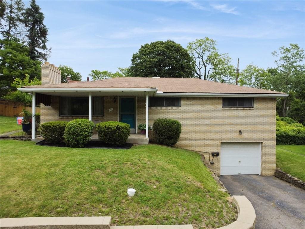 4 Wood Glen Ln, Wilkinsburg, PA 15235 - single story home featuring brick siding, an attached garage, a front lawn, a chimney, and asphalt driveway
