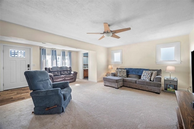 1217 Princeton Ave, Natrona Hts/Harrison Twp, PA 15065 - carpeted living area with ceiling fan, a textured ceiling, and baseboards