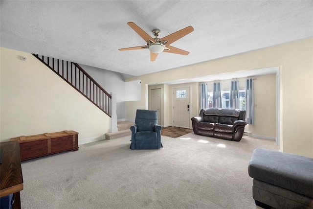 1217 Princeton Ave, Natrona Hts/Harrison Twp, PA 15065 - carpeted living area with stairway, a ceiling fan, and baseboards
