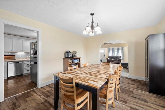 1217 Princeton Ave, Natrona Hts/Harrison Twp, PA 15065 - dining space featuring arched walkways, dark wood-style floors, a chandelier, baseboards, and ceiling fan