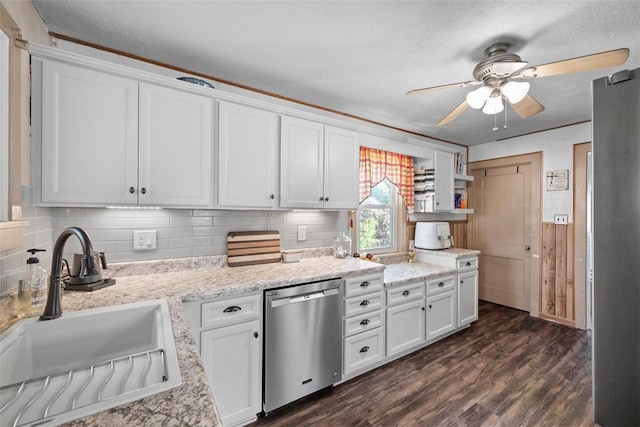 1217 Princeton Ave, Natrona Hts/Harrison Twp, PA 15065 - kitchen featuring stainless steel dishwasher, a sink, a ceiling fan, backsplash, and white cabinets