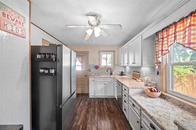 1217 Princeton Ave, Natrona Hts/Harrison Twp, PA 15065 - kitchen featuring appliances with stainless steel finishes, a sink, dark wood-style flooring, ceiling fan, and white cabinetry