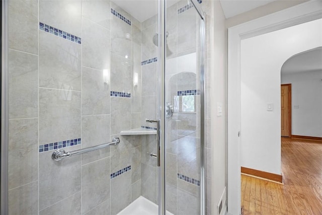 61 Ehle Ave, Kennedy Twp, PA 15108 - bathroom featuring a stall shower, baseboards, and wood finished floors