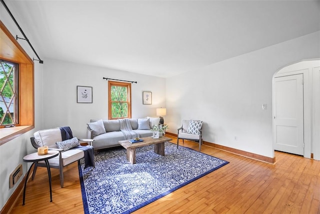 61 Ehle Ave, Kennedy Twp, PA 15108 - living area featuring hardwood / wood-style floors, arched walkways, and baseboards