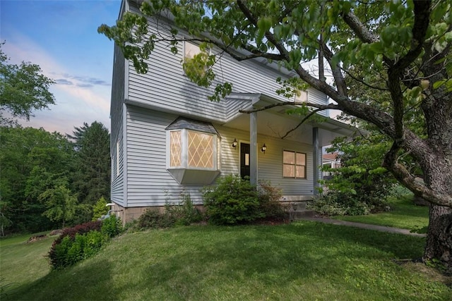61 Ehle Ave, Kennedy Twp, PA 15108 - bungalow with a front lawn and a porch