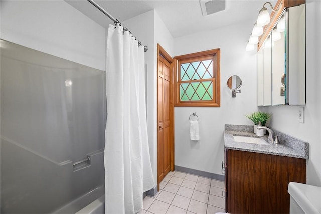 61 Ehle Ave, Kennedy Twp, PA 15108 - full bath with vanity, tile patterned flooring, shower / tub combo, and baseboards