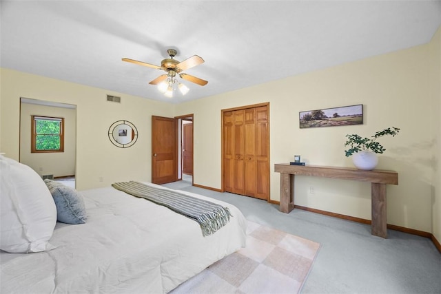 61 Ehle Ave, Kennedy Twp, PA 15108 - bedroom with light colored carpet, baseboards, a closet, and a ceiling fan