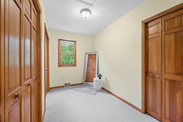 61 Ehle Ave, Kennedy Twp, PA 15108 - laundry area featuring baseboards, light carpet, and a textured ceiling