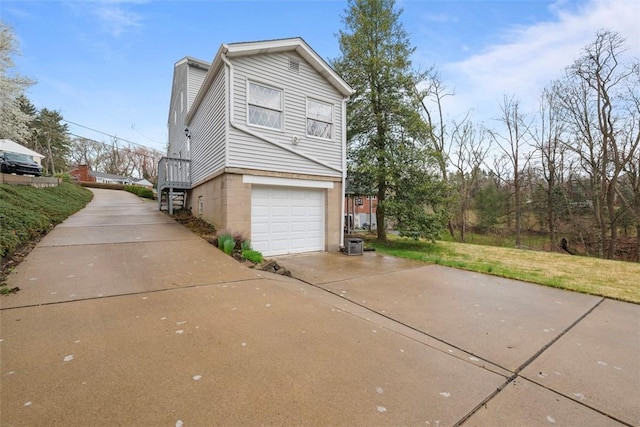 61 Ehle Ave, Kennedy Twp, PA 15108 - view of side of home featuring concrete driveway and an attached garage