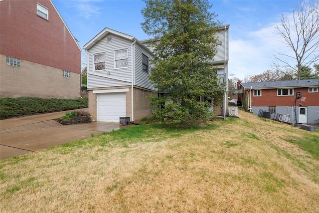 61 Ehle Ave, Kennedy Twp, PA 15108 - view of front facade featuring concrete driveway, an attached garage, and a front lawn