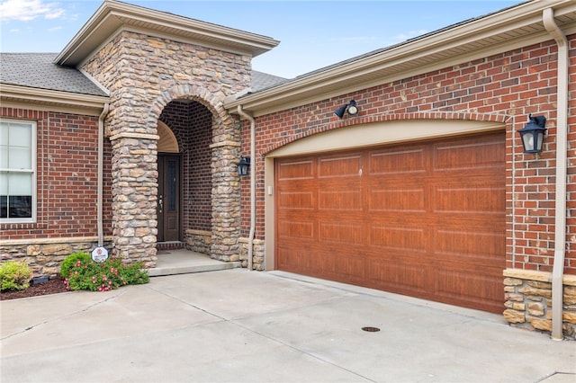 209 Lucca Ln, Upper St Clair, PA 15241 - entrance to property featuring brick siding, driveway, and stone siding